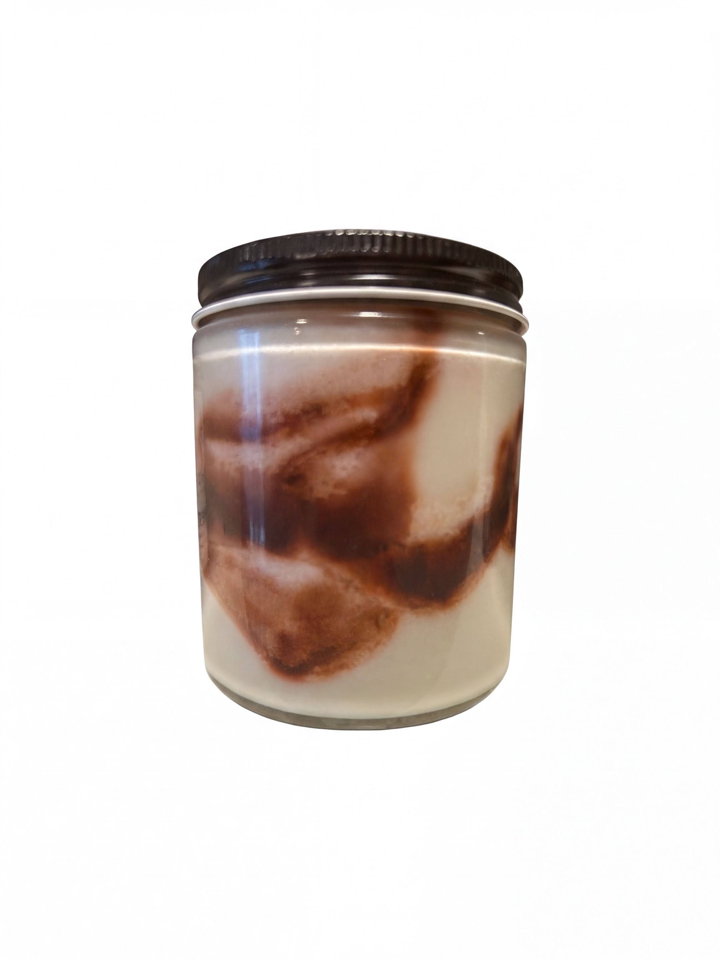A glass jar with a black lid, containing a chocolate-flavored substance, such as a chocolate-flavored cream or sauce.