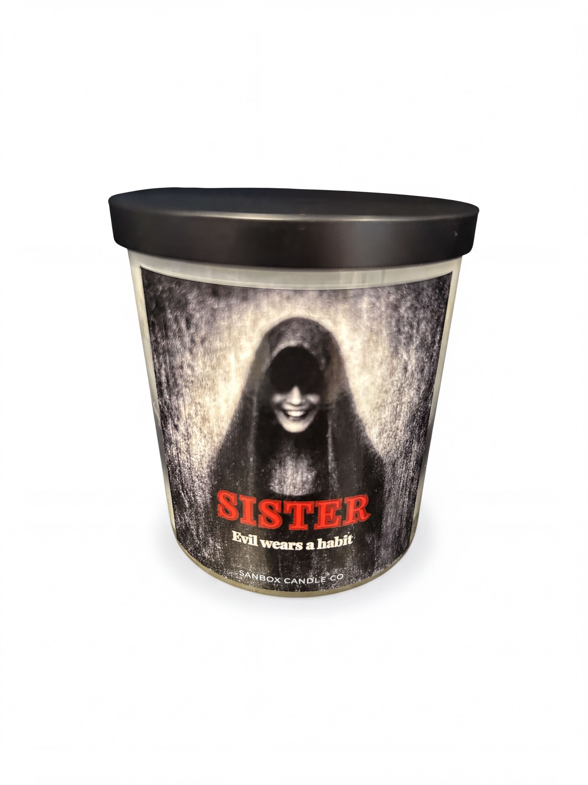 a cylindrical container with a black lid and a label that includes a picture of a person with a hooded figure and the word "SISTER" written below it.