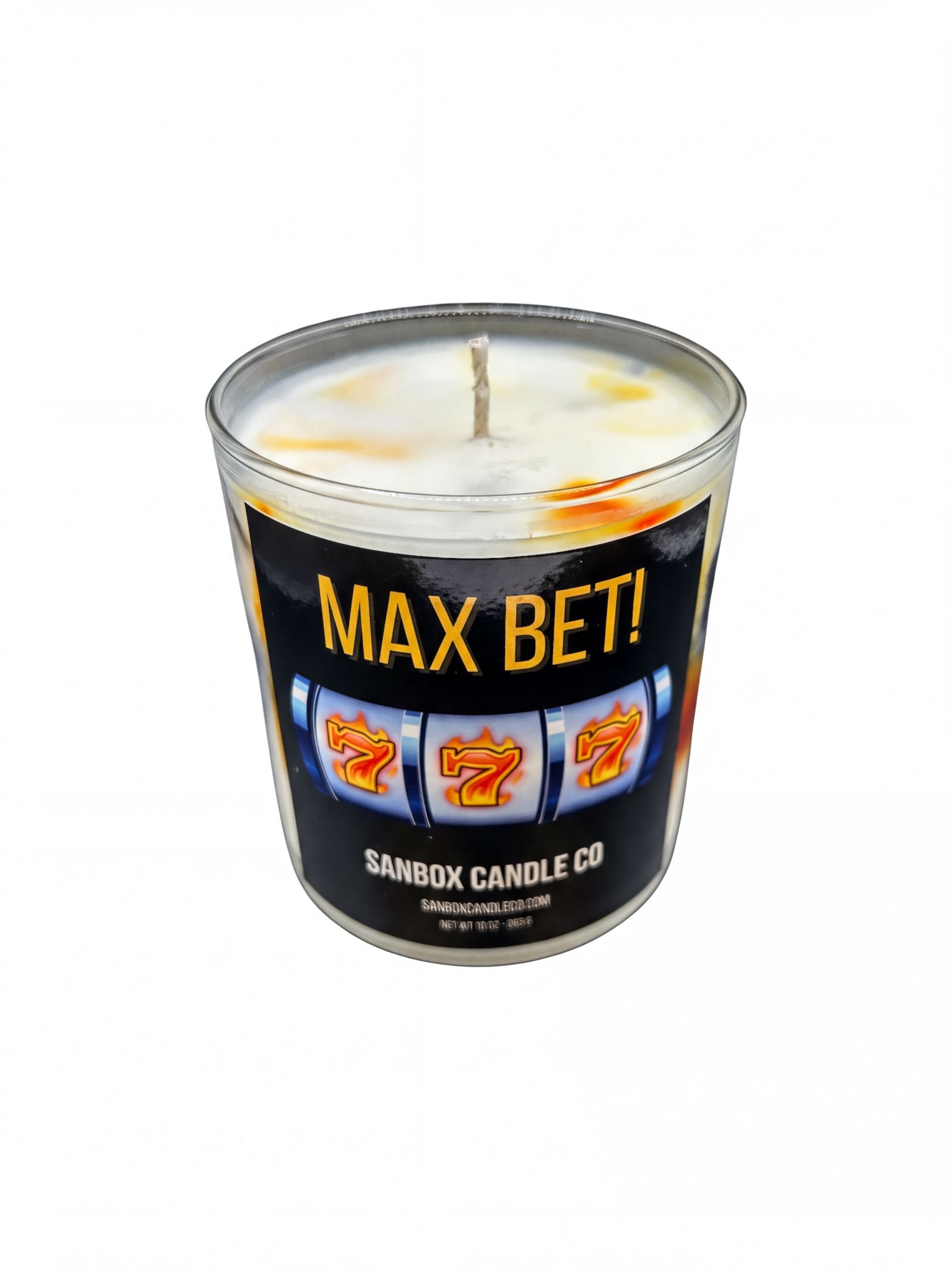 A cylindrical candle labeled "MAX BET!" with a casino-themed design featuring slot machine symbols.
