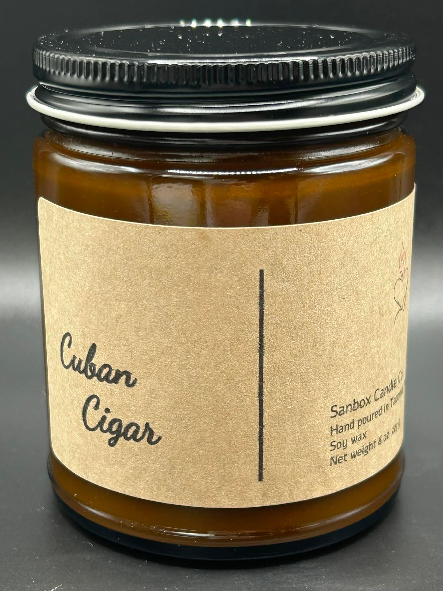 Cuban Cigar scented soy wax candle in amber glass jar with black lid