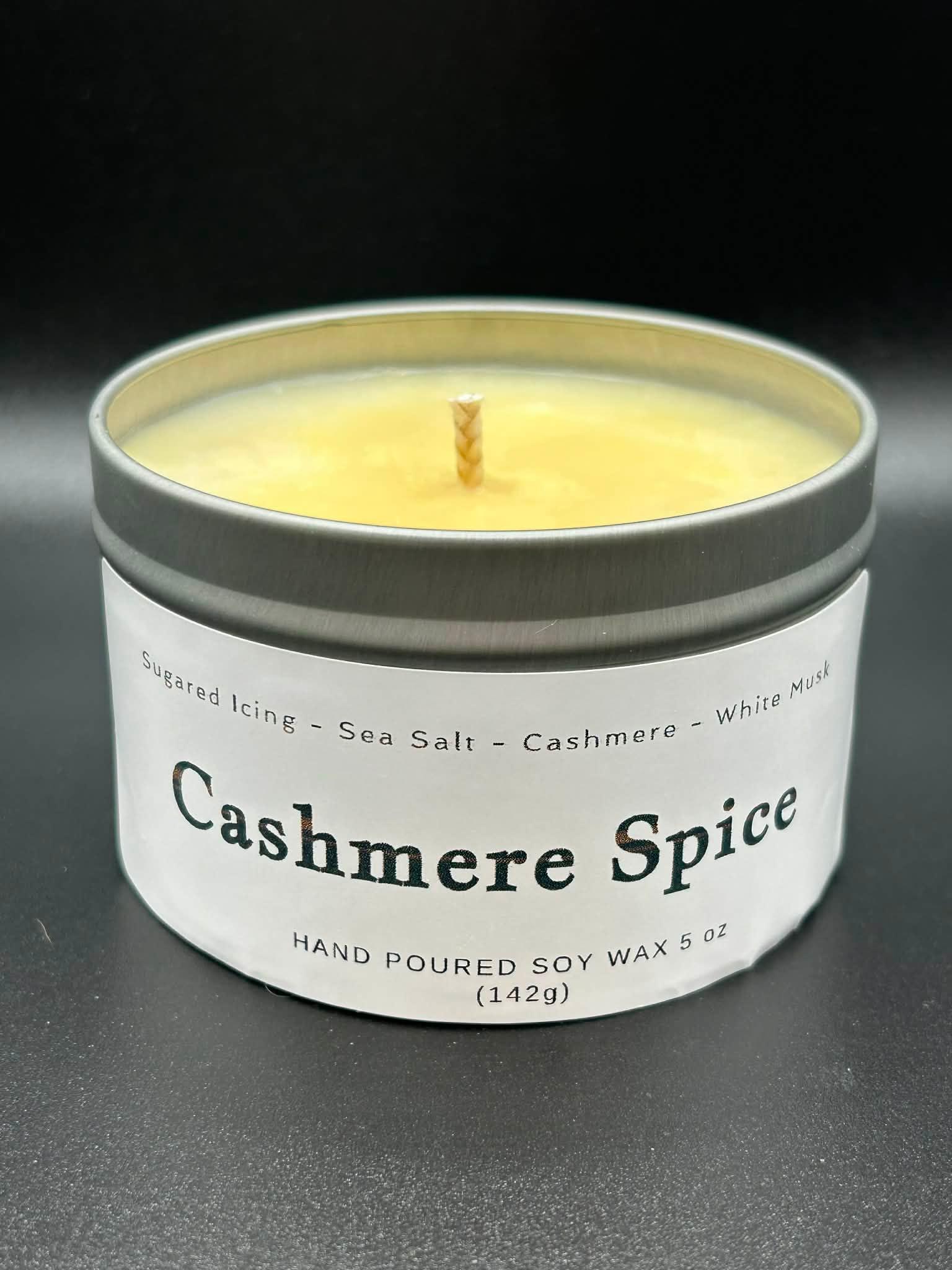 Cashmere Spice hand-poured soy wax candle in a metal tin, 5 oz size, with scent notes listed.