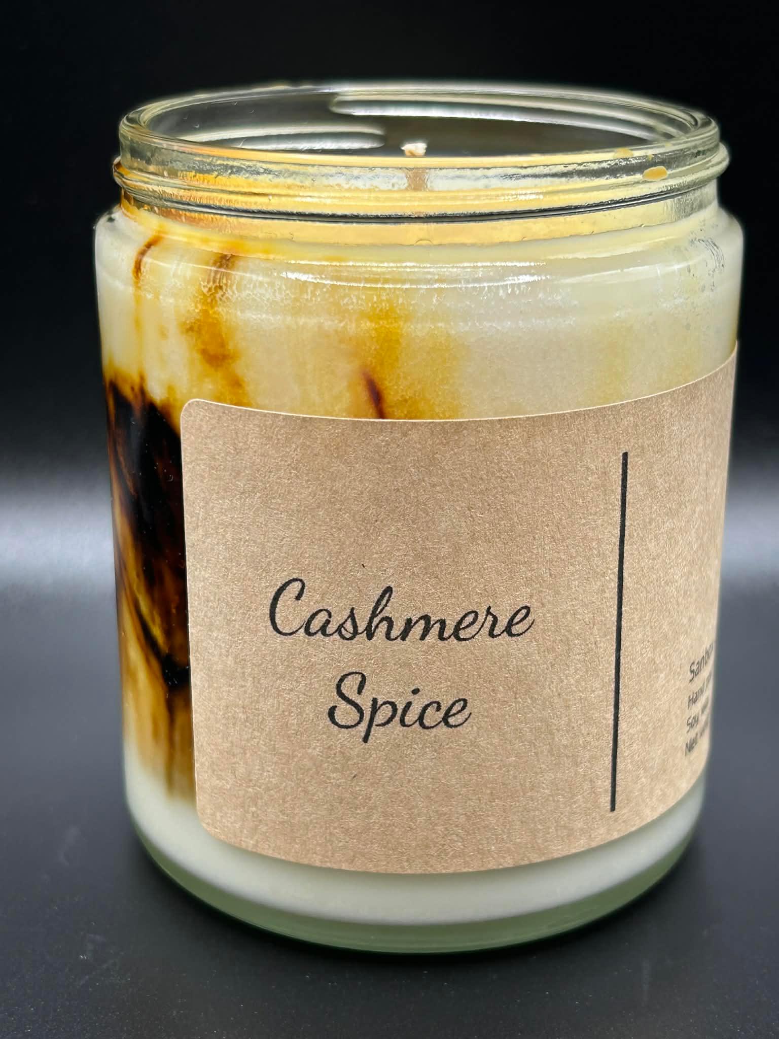 Cashmere Spice hand-poured scented candle in glass jar with brown and cream wax swirl