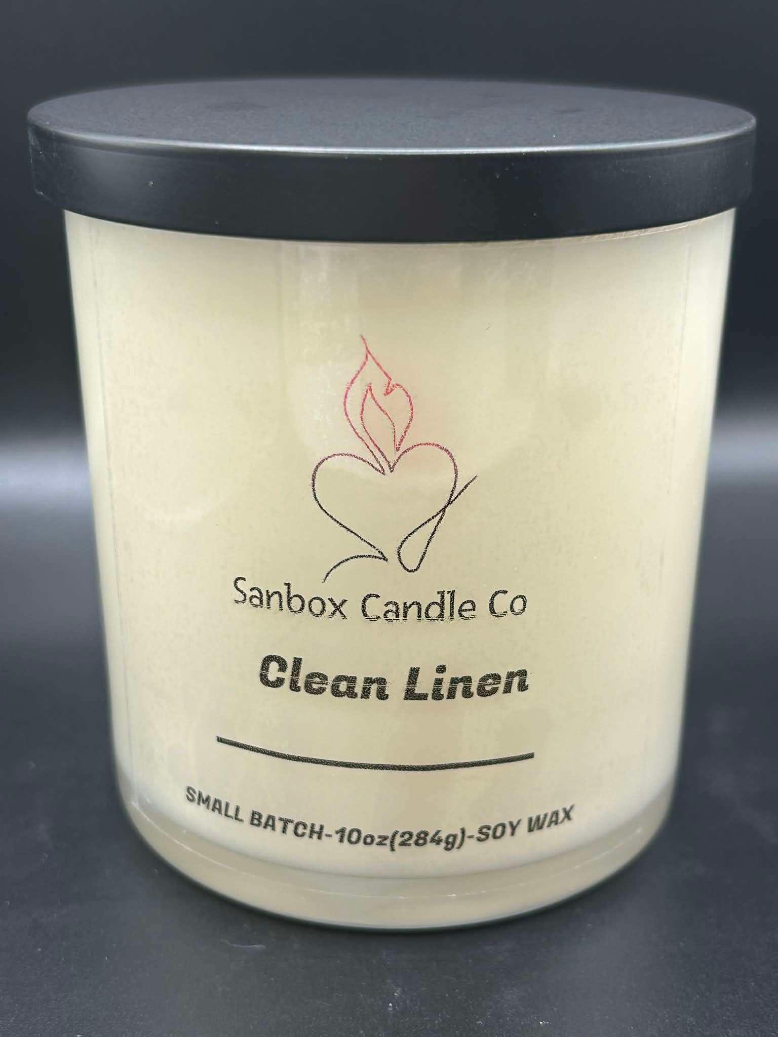 Clean Linen scented soy candle in glass jar with black lid, 10oz small batch.