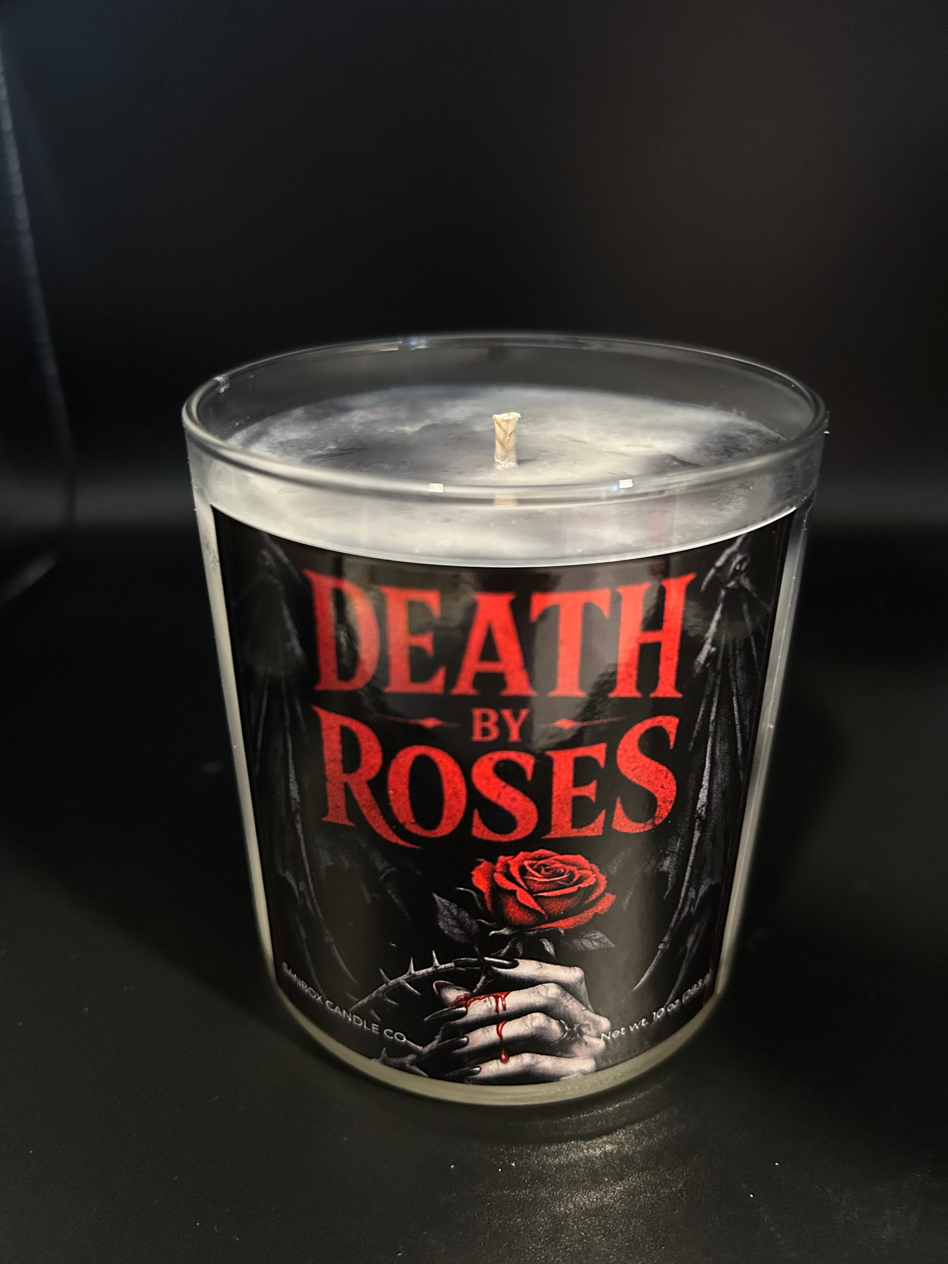 a candle with a label that reads "DEATH BY ROSES".