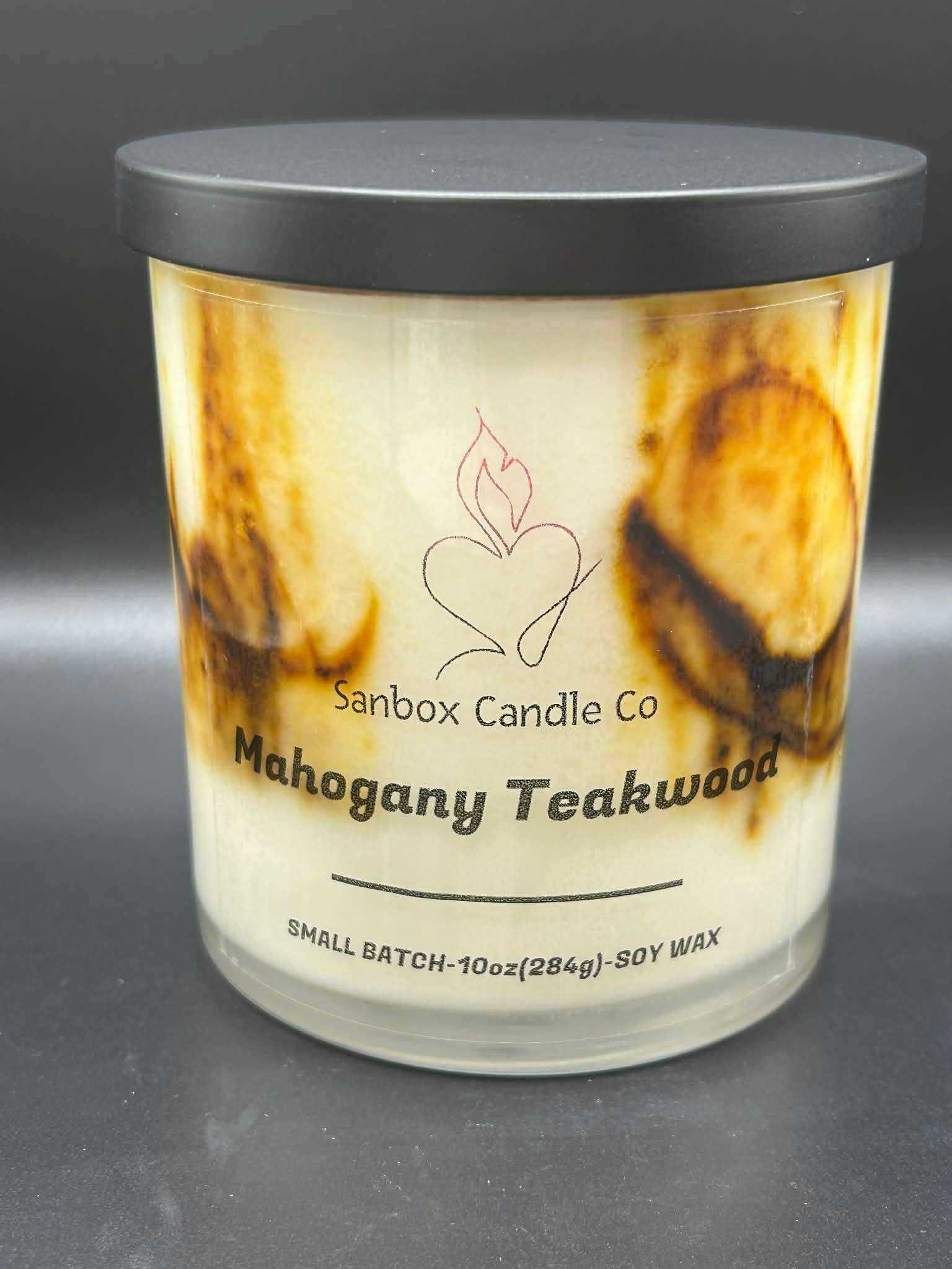 Mahogany Teakwood 10oz soy wax candle with black lid, cream wax, and brown marbling
