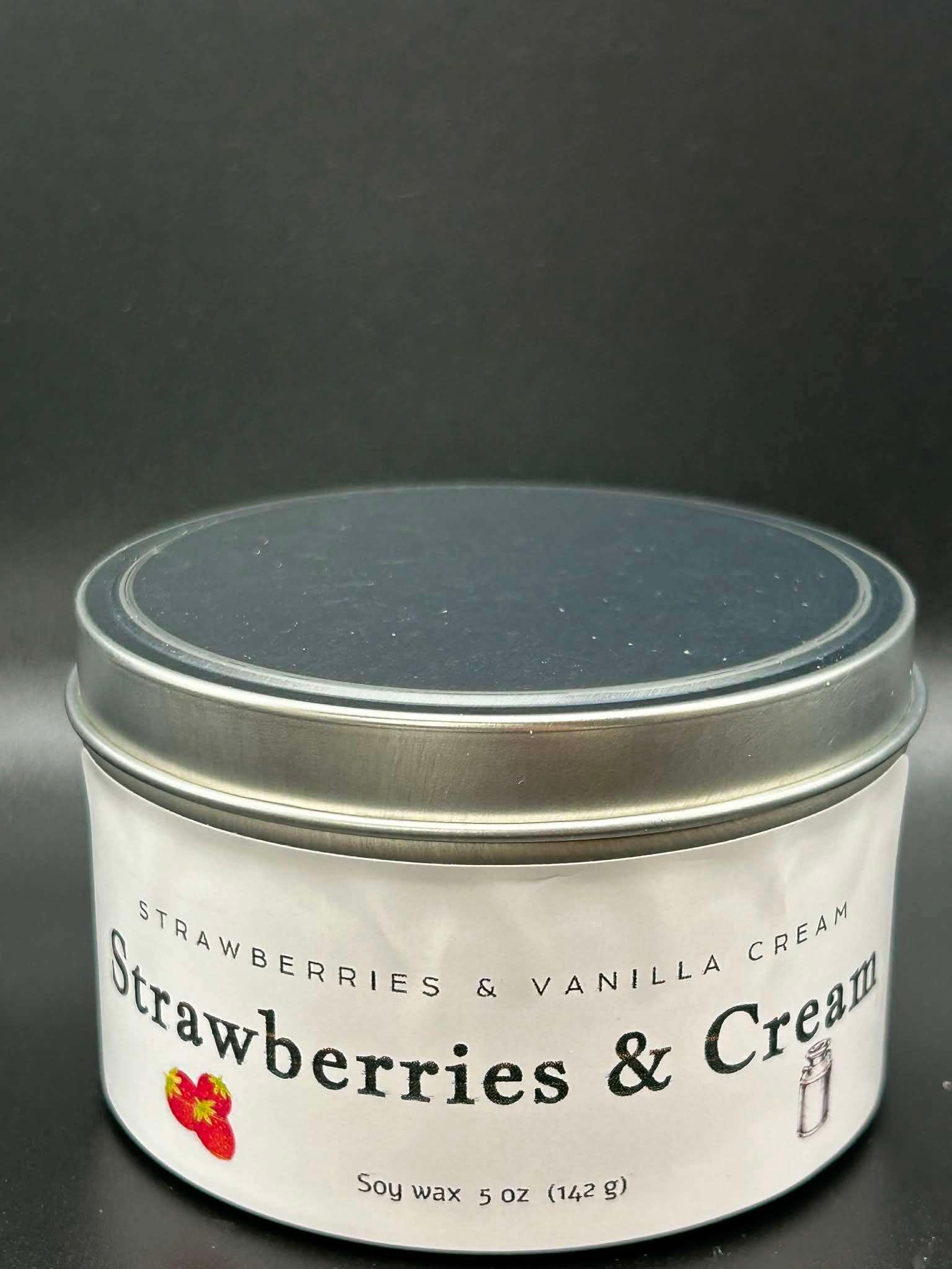 Strawberries and cream scented soy wax candle in a 5oz metal tin with minimalist label.