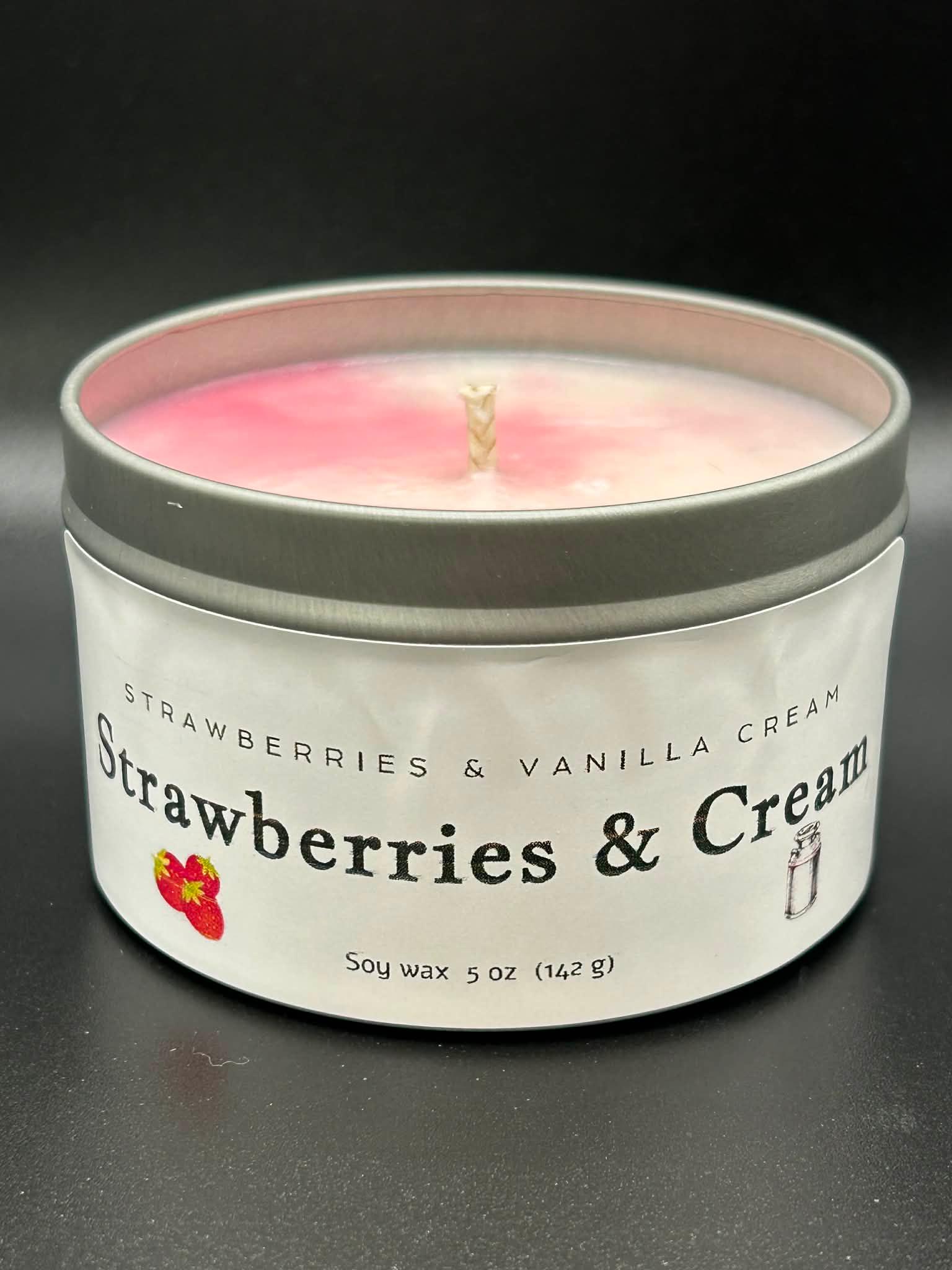 Strawberries and Cream scented soy wax candle in a tin with pink and white swirled wax