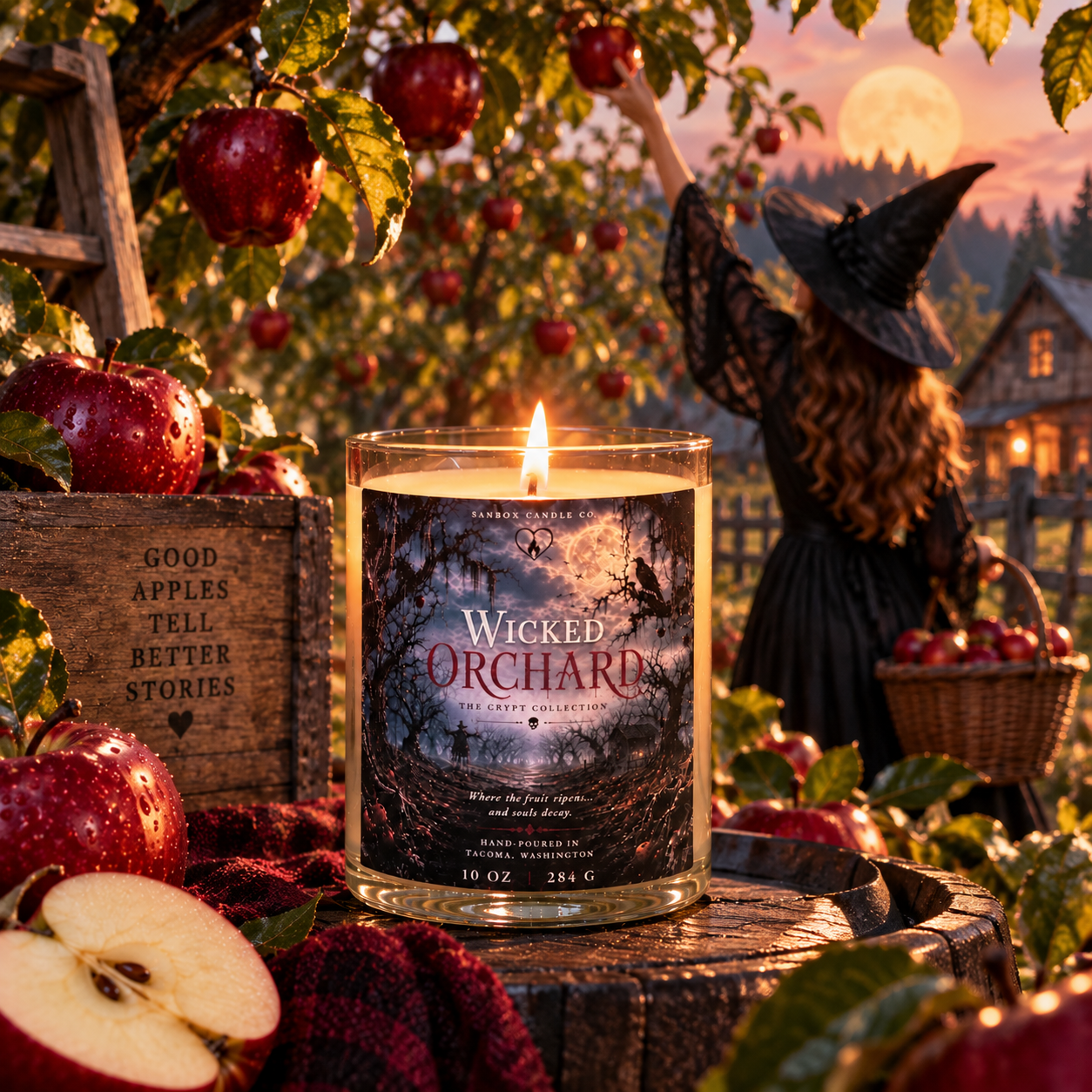 Wicked Orchard 10 oz apple amber soy candle burning in a clear glass jar with a black lid, surrounded by red apples, a skull, a raven, and vintage spell books in a gothic Halloween scene