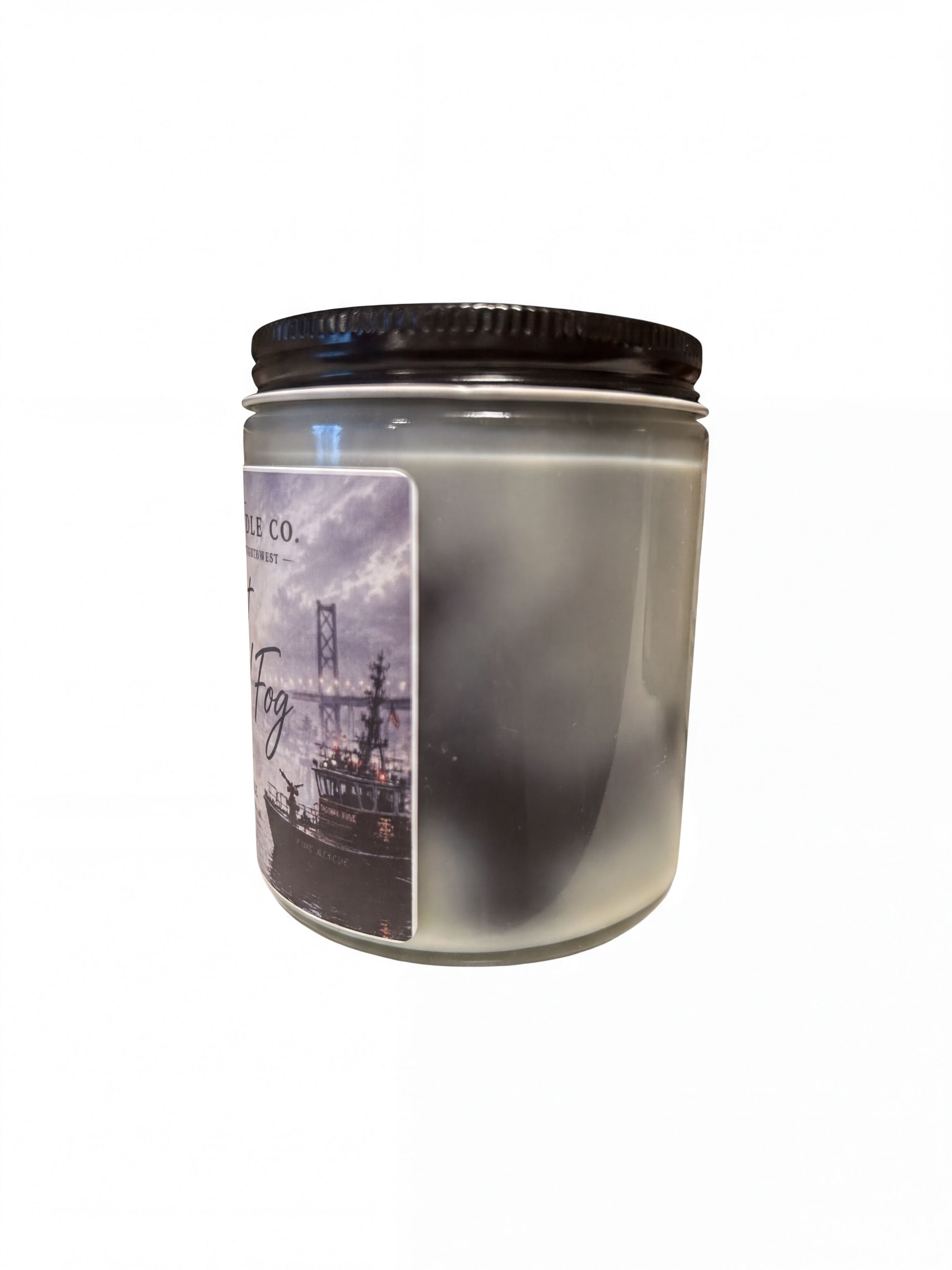 a cylindrical jar with a black lid, and there is a label on the jar with a picture of a ship and a bridge.