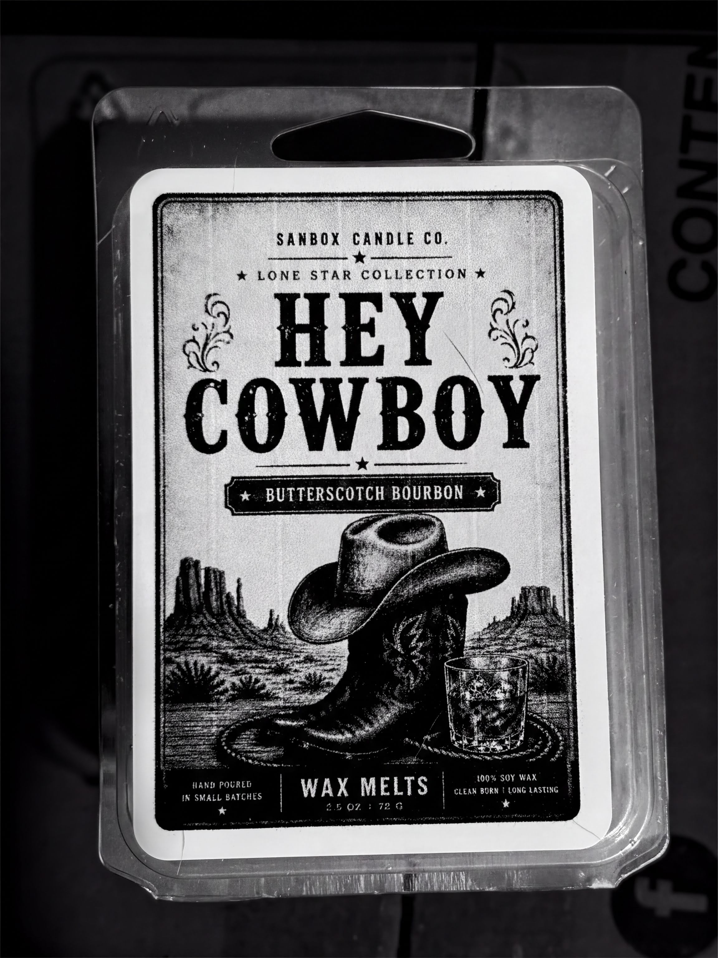 a package of Sanbox Candle Co. cowboy-themed butterscotch bourbon wax melts.