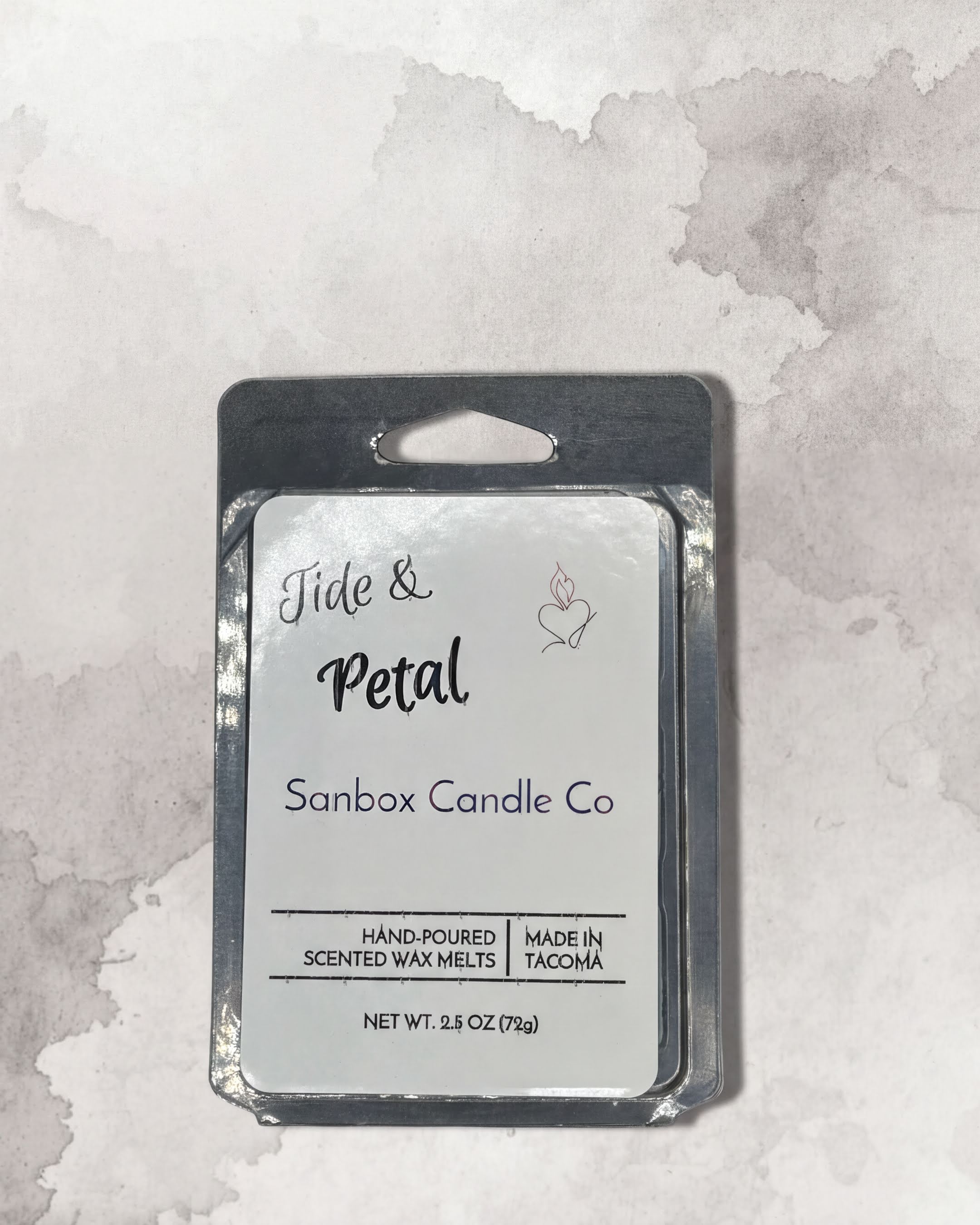 a package of hand-poured petal-shaped Sanbox candles from the Sanbox Candle Co.
