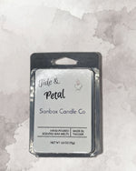 a package of hand-poured petal-shaped Sanbox candles from the Sanbox Candle Co.