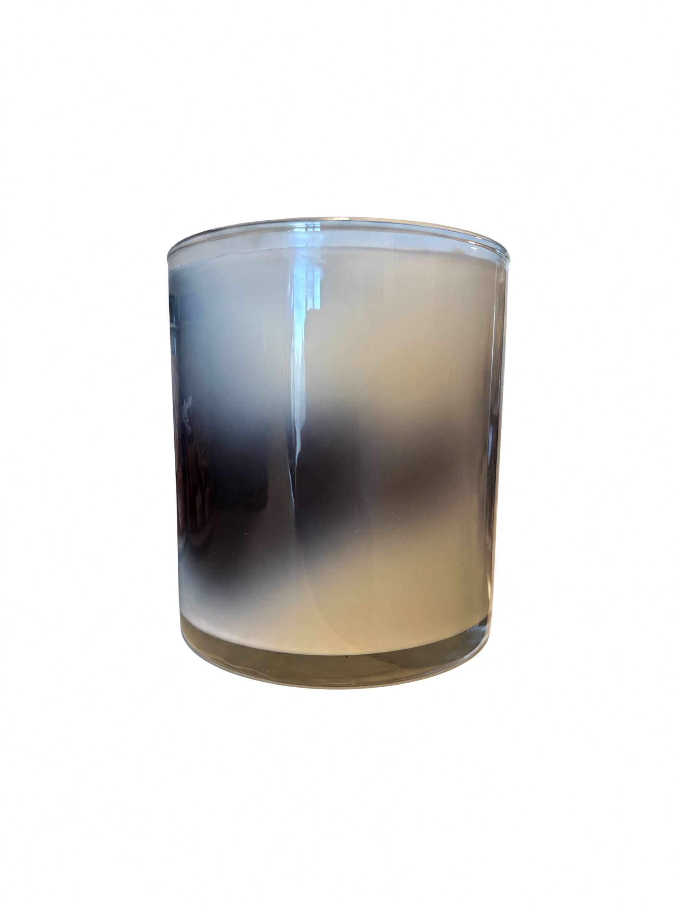 A glass candle holder with a foggy or misty appearance, creating a soft and ethereal effect.