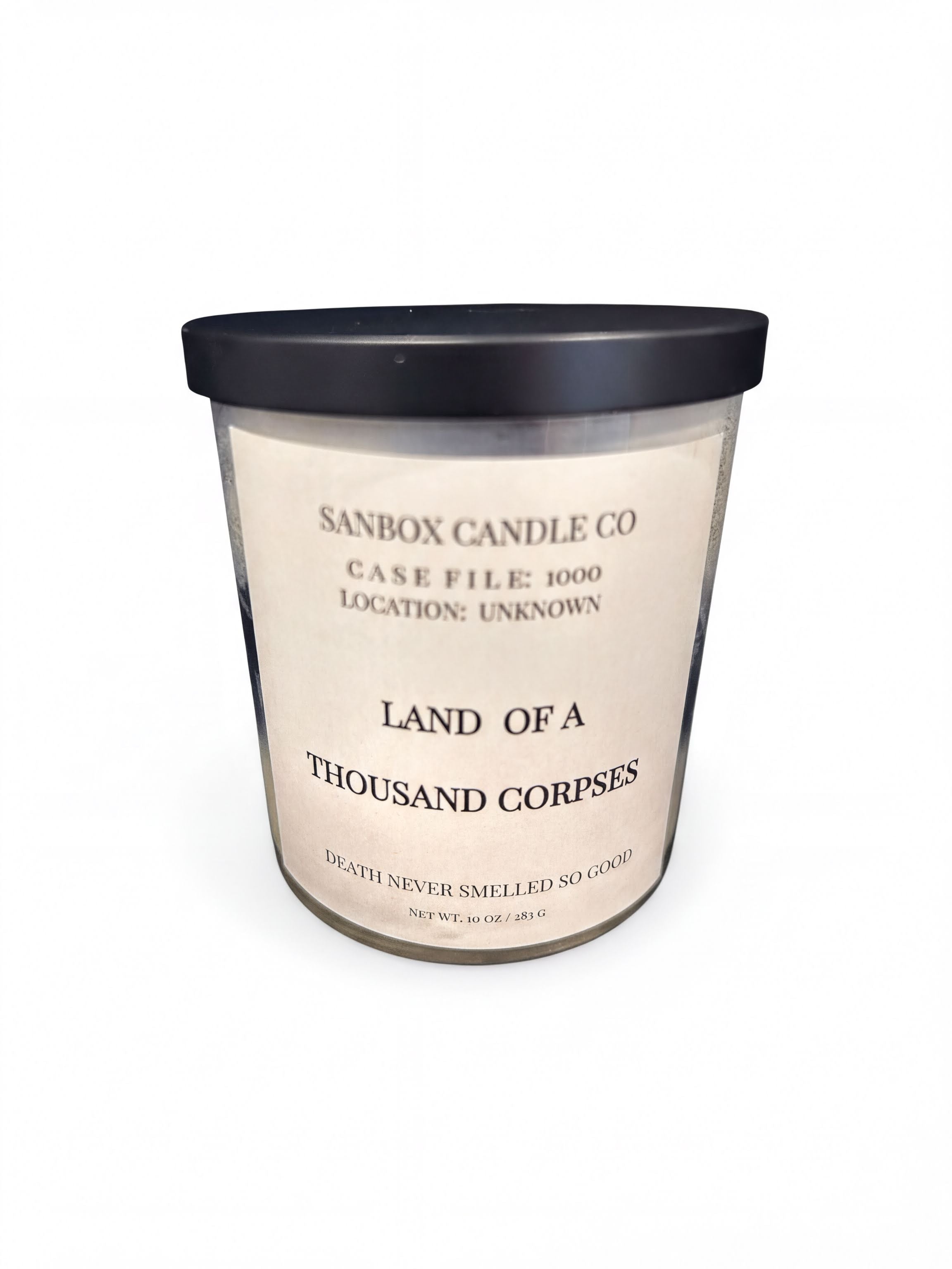 a candle labeled "Land of a Thousand Corpses" from Sanbox Candle Co.