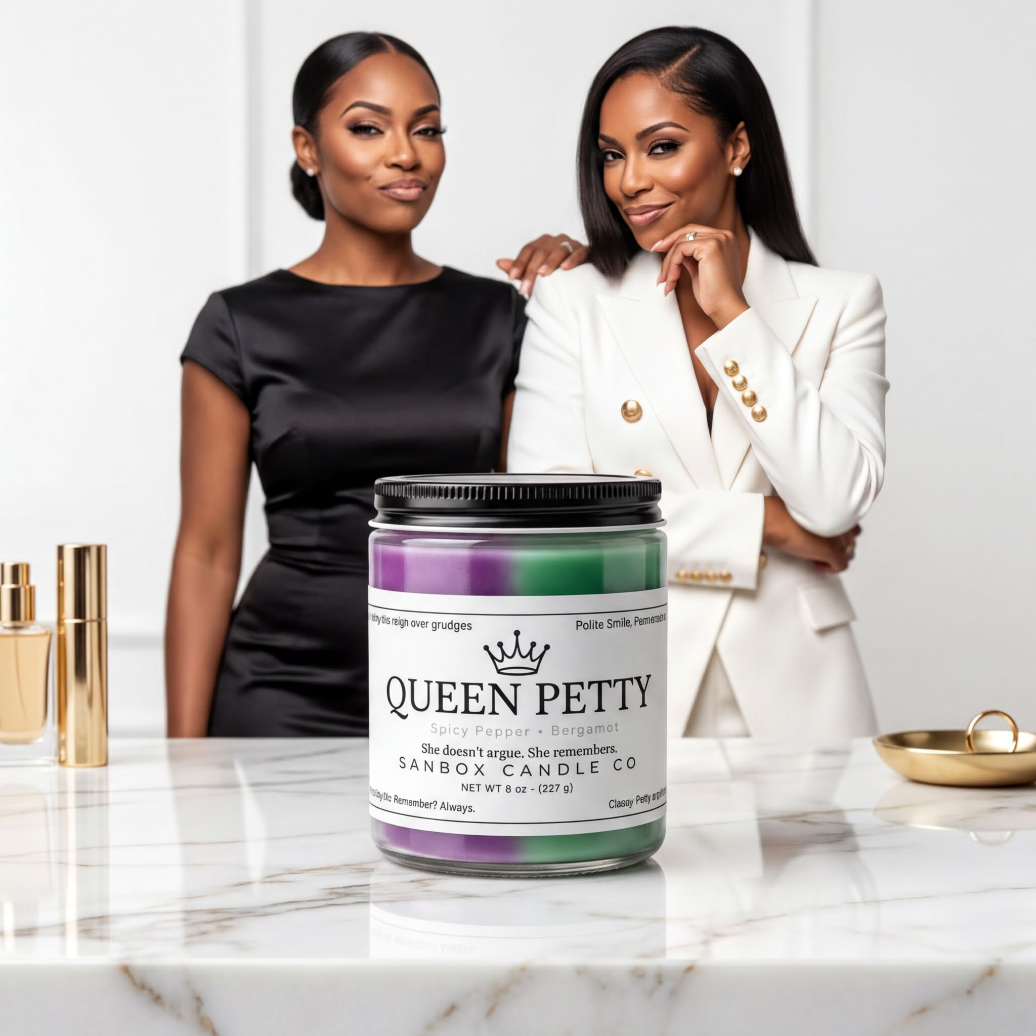 Two women standing next to a marble countertop, one wearing a black dress and the other in a white jacket, with a large jar of lavender-colored candle in the center.