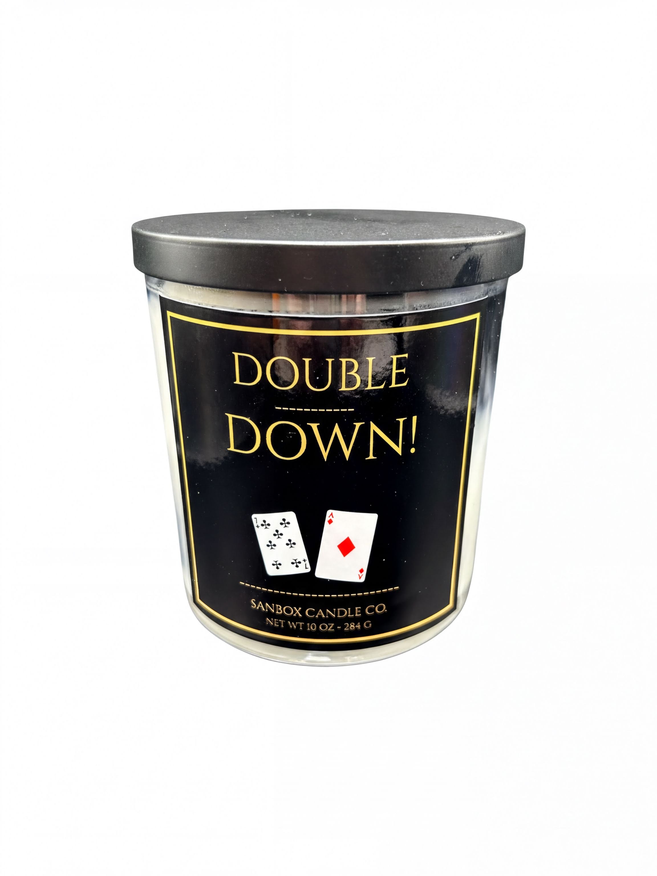 a cylindrical candle with a black lid and a label that reads "Double Down!".